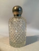 A cut glass cologne bottle with silver, spherical screw lid, internal glass stopper, Birmingham,