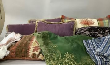 Three purple velvet cushions, another tartan and linen example and one red kilim cushion