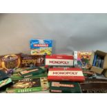 A quantity of vintage and new board games including Totopoly, Monopoly, Trivial Pursuit, Lord of the