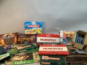 A quantity of vintage and new board games including Totopoly, Monopoly, Trivial Pursuit, Lord of the