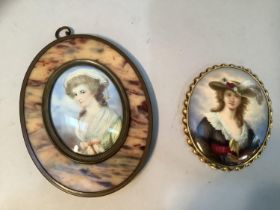 A porcelain plaque with an over painted print of Madame Vigee-Lebrun in a twirled brass frame,