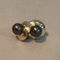 A pair of cultured pearl ear studs in 9ct gold each set to the centre with a 7.5mm stained pearl