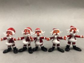 Six Murano glass Santa figures with two skiing Santas with some damages