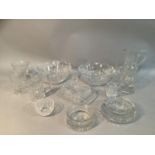 A pair of cut glass trifle bowls, a pair of etched glass mugs, a Yeoman coaster, an ashtray, a