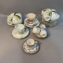 A set of four 19th century Spode coffee cups and saucers in grey and gilt, eight Crown Staffordshire