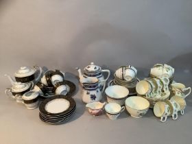 A 19th century Hammond china tea service of cobalt blue, pink and gilt comprising five cups and