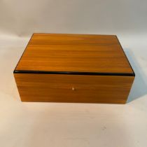A Hillwood walnut and ebonised laquered humidor, 30cm wide