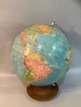 A 13" terrestrial globe on a wooden base