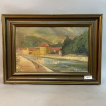 An early 20th century river landscape with buildings, oil on canvas, indistinctly signed Lily Hul***