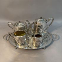 A four piece EPNS tea and coffee service of oval outline, beaded rims, engraved with a vacant