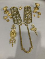 Two brass door plates having central pierced decoration together with door handles / knobs and other