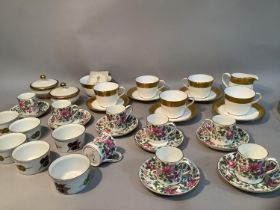 A Royal Crown Derby St George gilt tea set with five cups and saucers, sugar bowl and milk jug,