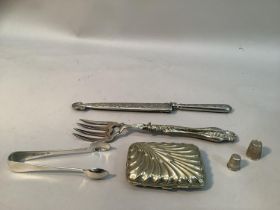 A white metal handled knife and sheath 25cm long, a silver-plated bread fork, sugar tongs, cigarette