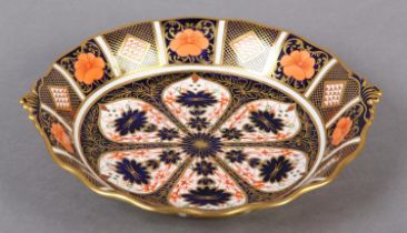 A Royal Crown Derby Imari pattern twin handled bonbon, date cypher for 1825, 25cm diameter