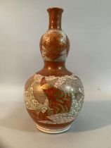 A 19th century Japanese gourd vase, red and gilt enameled with dragons and clouds, 20cm high