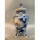 A 20th Century Delft ware blue and white vase and domed cover with flower bud finial, the body