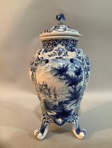A 20th Century Delft ware blue and white vase and domed cover with flower bud finial, the body