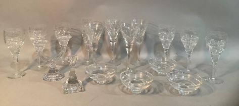 Four cut glass wine glasses with squared stems, six further moulded wine glasses, four matching