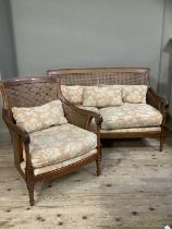 A mahogany framed double begere caned two seater sofa and armchair, upholstered with loose
