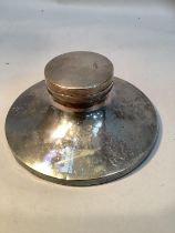 A silver inkwell on circular spreading base, 14cm diameter, Birmingham 1933