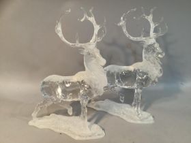 A pair of clear resin models of stags with applied glitter, 28cm high