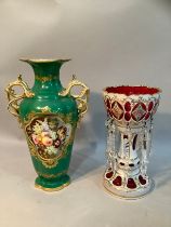 A 19th century Bohemian cranberry and white glass overlay lustre painted with flowers and gilt