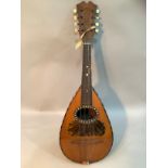 An early 20th century Italian mandolin in rosewood and boxwood with mother of pearl and tortoise