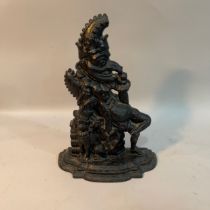 A Victorian cast iron and black painted door stop in the form of punch, 32.5cm high
