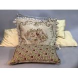 Two needlework and velvet cushions together with others