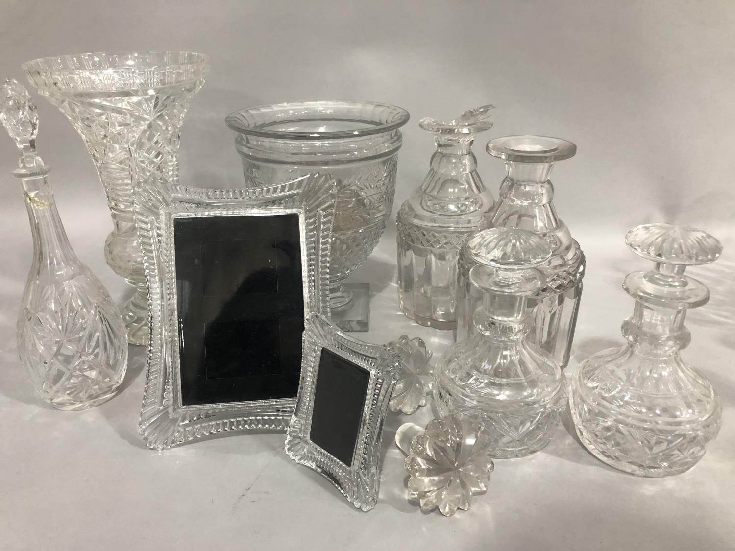 A 19th century cut glass pedestal vase and another, two decanters (one a/f) with associated