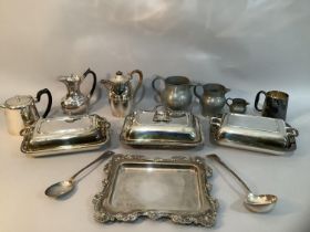 Three silver plate on copper lidded tureens, a tray with moulded edge, three teapots, three pewter
