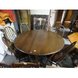 An Ercol Drop Leaf Dining Table & Six Spindle Back Chairs