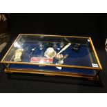 A Table Top Display Case Containing A Small Qty Of Collectables