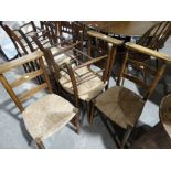 A Set Of Four Early 20thc Rush Seated Ladder Backed Schoolroom Type Chairs