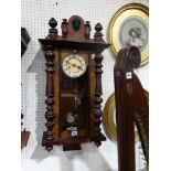 An Edwardian Pendulum Wall Clock With Circular Dial