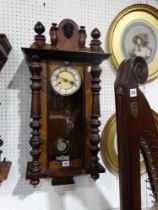 An Edwardian Pendulum Wall Clock With Circular Dial