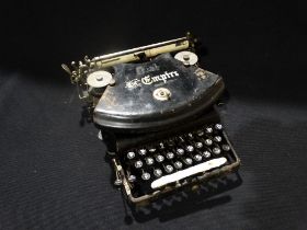 A Cased Vintage "The Empire" Portable Typewriter