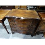 A Serpentine Fronted Mahogany Four Drawer Chest With Dressing Slide