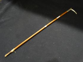 An Antique Riding Crop With Plated Handle & Silver Band