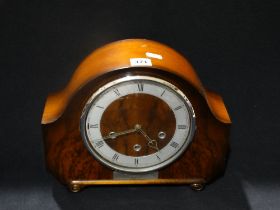 An Early 20thc Polished Mantel Clock With Circular Silvered Dial