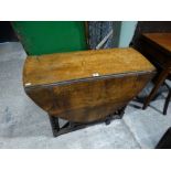 An Antique Oak Gate Leg Table With End Drawer