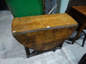 An Antique Oak Gate Leg Table With End Drawer