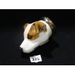 A Pottery Stirrup Cup Modelled As A Beagle