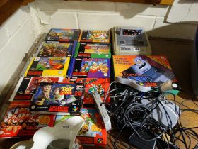 A Nintendo Super Nintendo Entertainment System, Together With Controllers & Qty Of Games