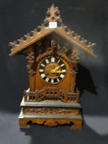 An Early 20thc Black Forest Type Mantel Clock With Cuckoo Movement