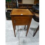 An Edwardian Single Door Bedside Table On Tapered Supports
