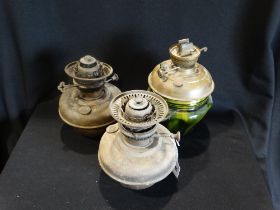 A Drip Glazed Pottery Oil Lamp Base With Brass Bowl, Together With Two Further Brass Oil Lamp Bowls