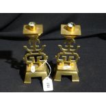 A Pair Of Chinese Brass Four Footed Candle Holders