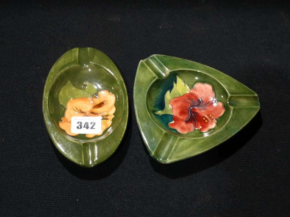 Two Green Ground Moorcroft Floral Decorated Ashtrays