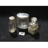 Three Silver Topped Glass Dressing Table Bottles